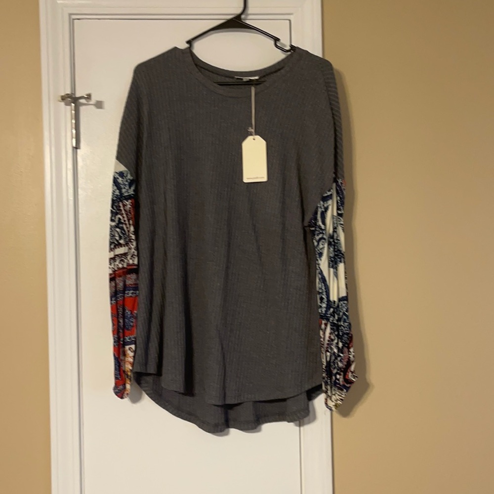 NWT long sleeve tee. With printed sleeves.